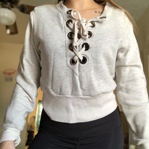 Cropped lace up sweater
